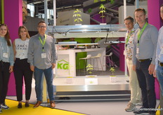 Team KG Greenhouses and KG Systems next to their cannabis gimmick